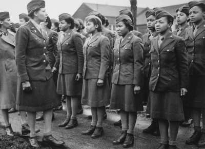 Captain Mary Kearney and Major Charity Adams inspect the first arrivals of the 6888th Central Postal Directory Battalion in Birmingham, England, on February 15, 1945.