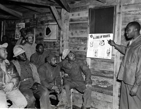 Staff Sergeant Herbert Ellison explains the GI Bill to fellow soldiers